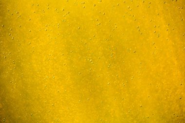 Su arka planında soyut altın ve beyaz bokeh ve kabarcıklar