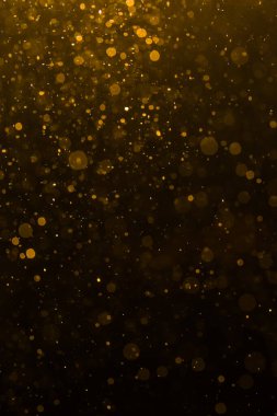 Siyah arkaplan ile soyut altın bokeh