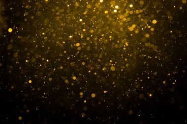 Siyah arkaplan ile soyut altın bokeh