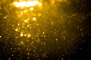 Siyah arkaplan ile soyut altın bokeh