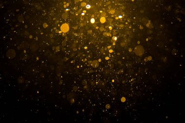 Siyah arkaplan ile soyut altın bokeh