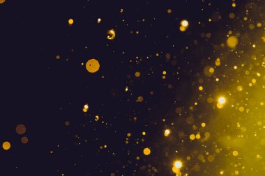 Siyah arka plan üzerinde soyut altın bokeh