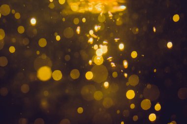 Lüks Altın, siyah arkaplanda soyut bir bokeh