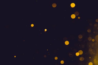 Siyah arka plan üzerinde soyut altın bokeh