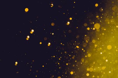 Siyah arka plan üzerinde soyut altın bokeh