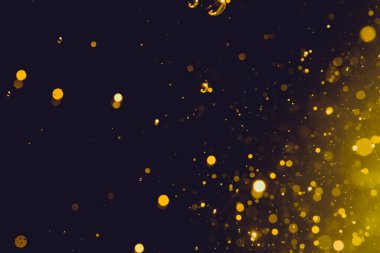 Siyah arka plan üzerinde soyut altın bokeh