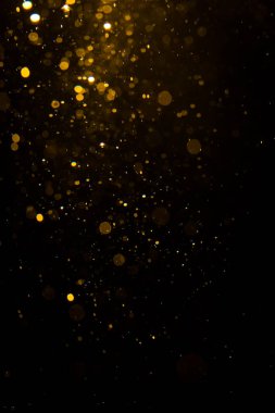 Siyah arkaplan ile soyut altın bokeh