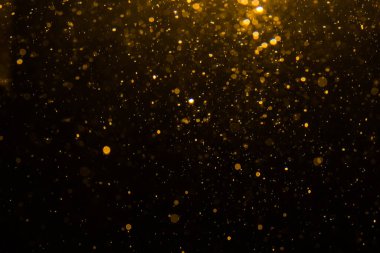Siyah arkaplan ile soyut altın bokeh