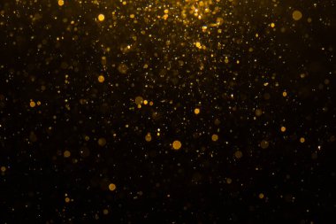 Siyah arkaplan ile soyut altın bokeh