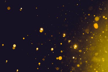 Siyah arka plan üzerinde soyut altın bokeh