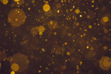 Soyut bulanık altın parıltılı bokeh arkaplan