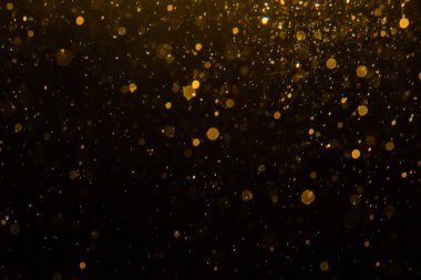 Siyah arkaplan ile soyut altın bokeh