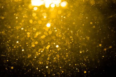 Siyah arkaplan ile soyut altın bokeh