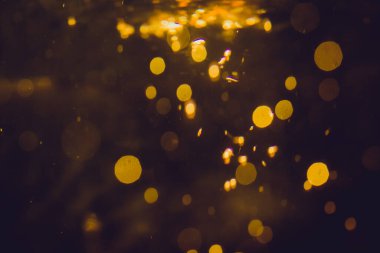 Lüks Altın, siyah arkaplanda soyut bir bokeh