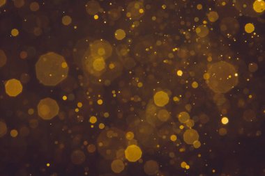 Soyut bulanık altın parıltılı bokeh arkaplan