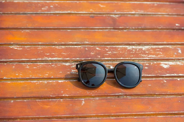 Czarna Moda Okulary Tle Drewnianego Stołu — Zdjęcie stockowe