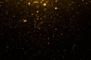 Siyah arkaplan ile soyut altın bokeh