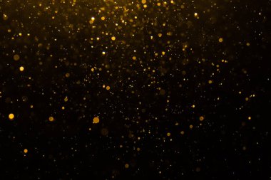 Siyah arkaplan ile soyut altın bokeh