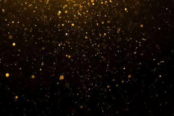 Siyah arkaplan ile soyut altın bokeh