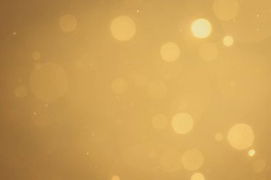 Siyah arkaplanda koyu soyut altın bokeh parıltısı