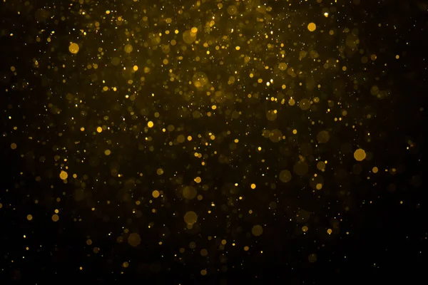 Siyah arkaplan ile soyut altın bokeh