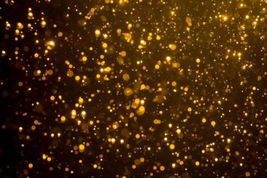 Mutlu Noeller ve yeni yıl arkaplanı için altın rengi parıltılı ışıklar soyut bokeh