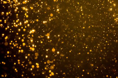 Mutlu Noeller ve yeni yıl arkaplanı için altın rengi parıltılı ışıklar soyut bokeh