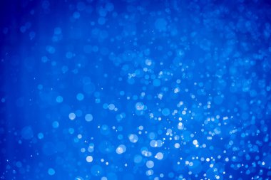 Soyut koyu mavi noel sim ışıkları bokeh arkaplanının odak noktasını kaldırdı