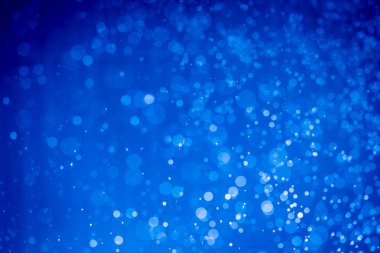 Soyut koyu mavi noel sim ışıkları bokeh arkaplanının odak noktasını kaldırdı