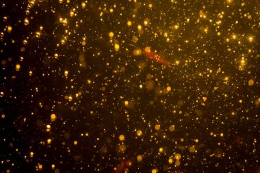 Mutlu Noeller ve yeni yıl arkaplanı için altın rengi parıltılı ışıklar soyut bokeh