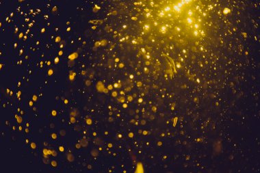 Siyah arkaplan ile soyut altın bokeh