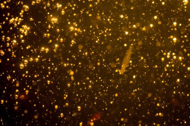 Mutlu Noeller ve yeni yıl arkaplanı için altın rengi parıltılı ışıklar soyut bokeh