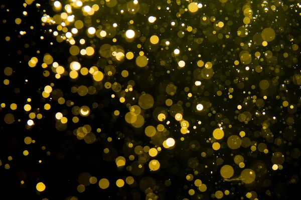ゴールデンブラーグリッターライト抽象的なボケのためのメリークリスマスと新年の背景 — ストック写真