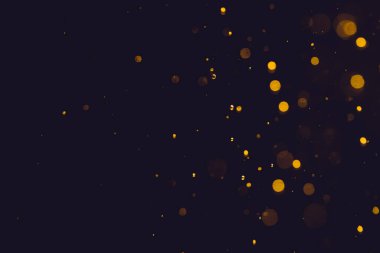 Siyah arkaplanda koyu soyut altın bokeh parıltısı