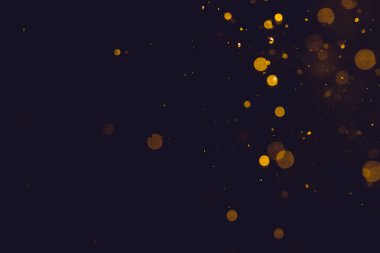 Siyah arkaplanda koyu soyut altın bokeh parıltısı