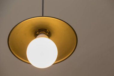 Lamp hanging on a gray wall background