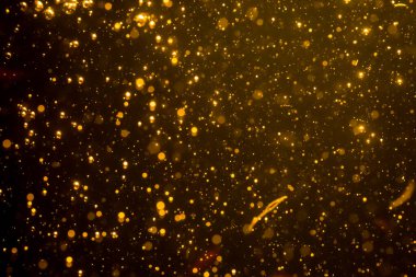 Mutlu Noeller ve yeni yıl arkaplanı için altın rengi parıltılı ışıklar soyut bokeh