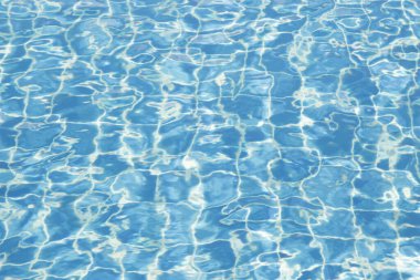 Havuz deseni arka planına ışık yansıtılıyor