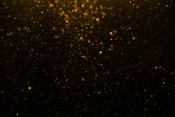 Siyah arkaplan ile soyut altın bokeh
