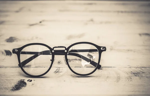 Black Frame Clear Glasses Vintage Table Background — стоковое фото
