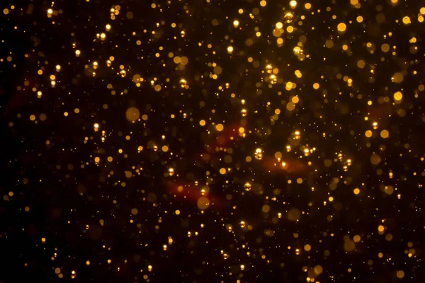 Mutlu Noeller ve yeni yıl arkaplanı için altın rengi parıltılı ışıklar soyut bokeh