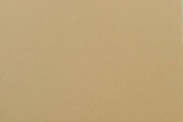 背景には茶色い再生紙の質感 — ストック写真