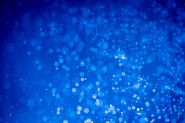 Soyut koyu mavi noel sim ışıkları bokeh arkaplanının odak noktasını kaldırdı