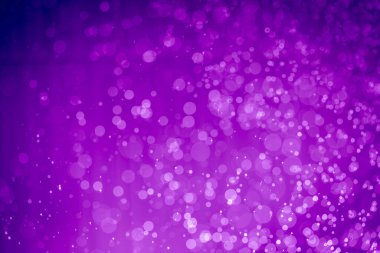 Soyut menekşe mor parıltılı ışıklar Odaklanmış bokeh arkaplanı