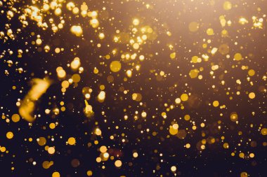 Siyah arkaplan ile soyut altın bokeh