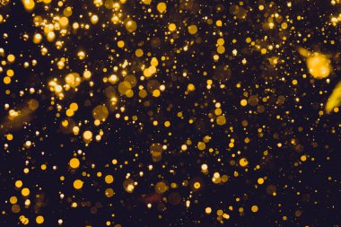 Siyah arkaplan ile soyut altın bokeh