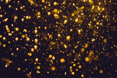 Siyah arkaplan ile soyut altın bokeh