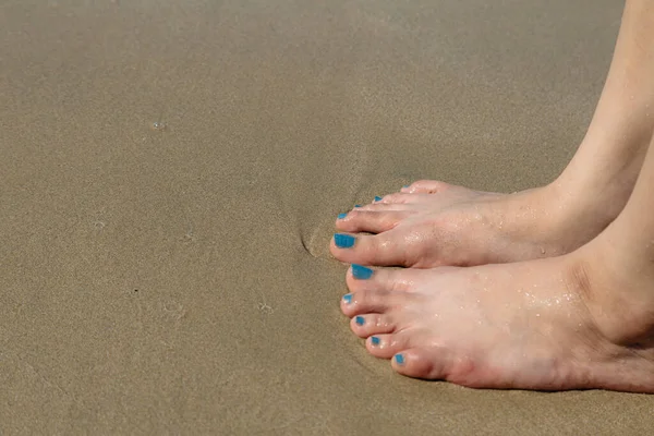 Woman Foot Nailed Sand Beach — стоковое фото