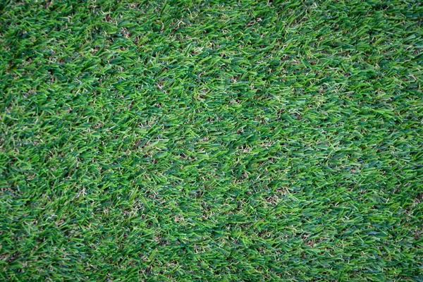 Yeşil yapay çim zemin arka planı