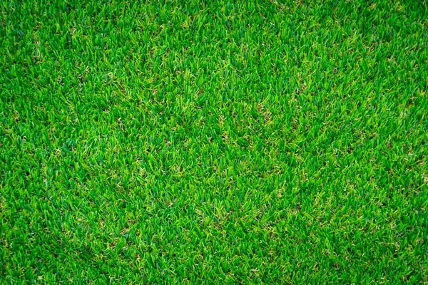 Yeşil yapay çim zemin arka planı
